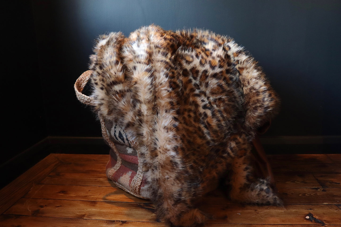 Large luxurious leopard print throw with a brown suede-feel underside.